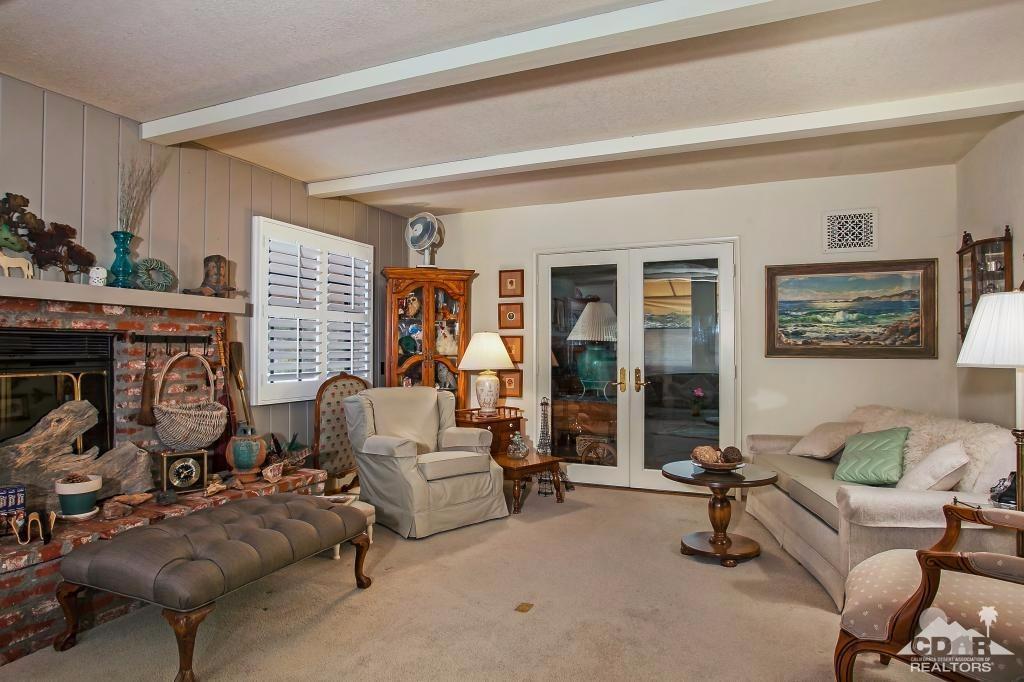 60189 Devils Ladder Road Mountain Center, CA 92561 - Photo 11 of 25 a living room with furniture and a fireplace