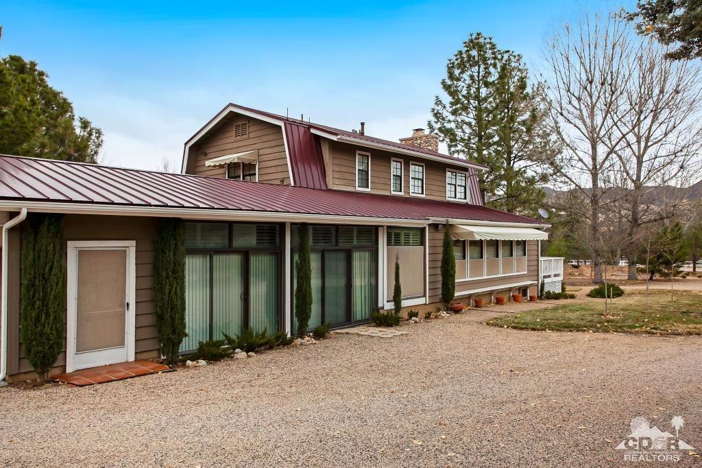 60189 Devils Ladder Road Mountain Center, CA 92561 - Photo 3 of 25 a front view of a house with a yard