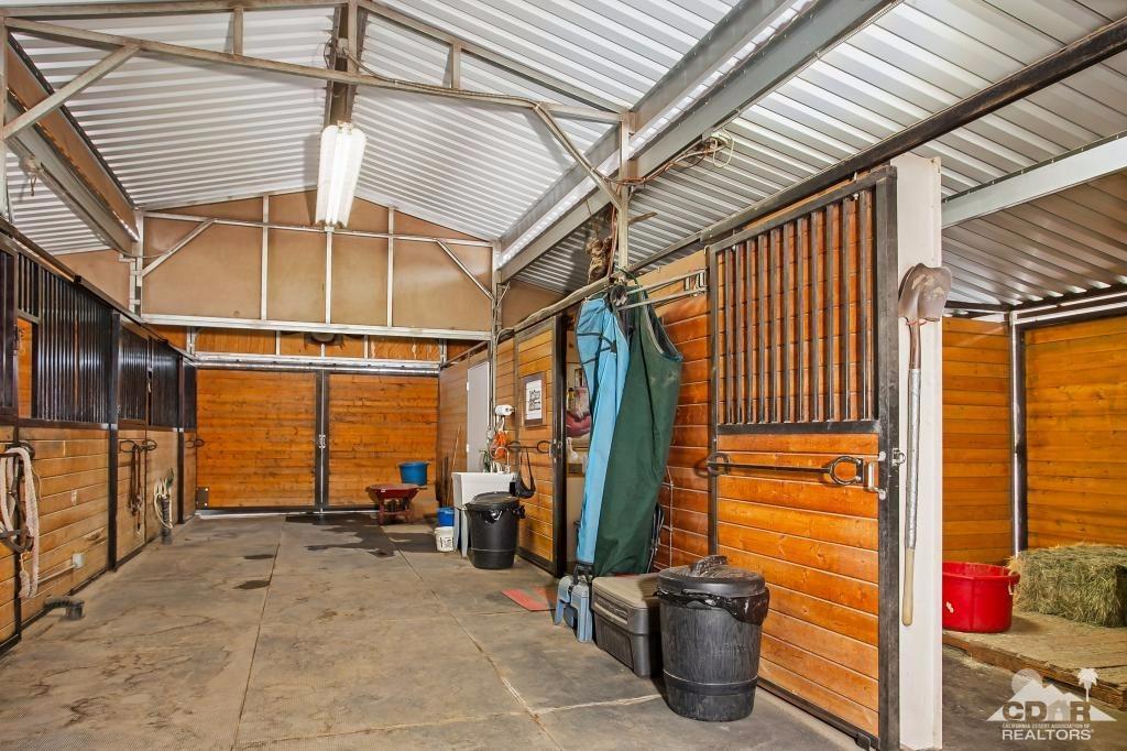 60189 Devils Ladder Road Mountain Center, CA 92561 - Photo 22 of 25 a view of a porch with wooden floor and furniture