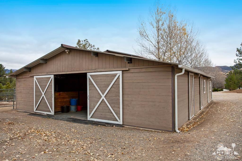 60189 Devils Ladder Road Mountain Center, CA 92561 - Photo 25 of 25 a view of a house with a backyard
