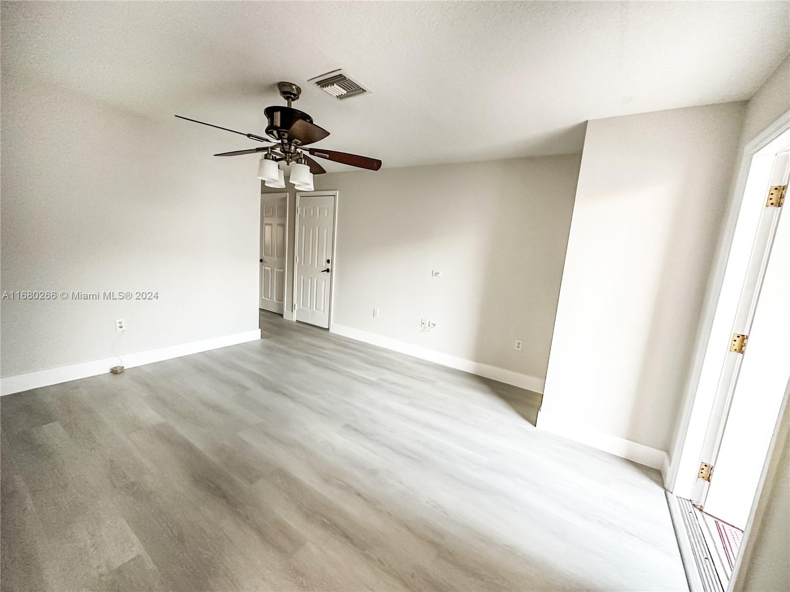 13970 Southwest 260th Street, Unit 105 Homestead, FL 33032 - Photo 4 of 31 a view of a room with a sink and cabinets
