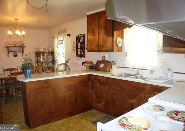 a kitchen with a sink and cabinets