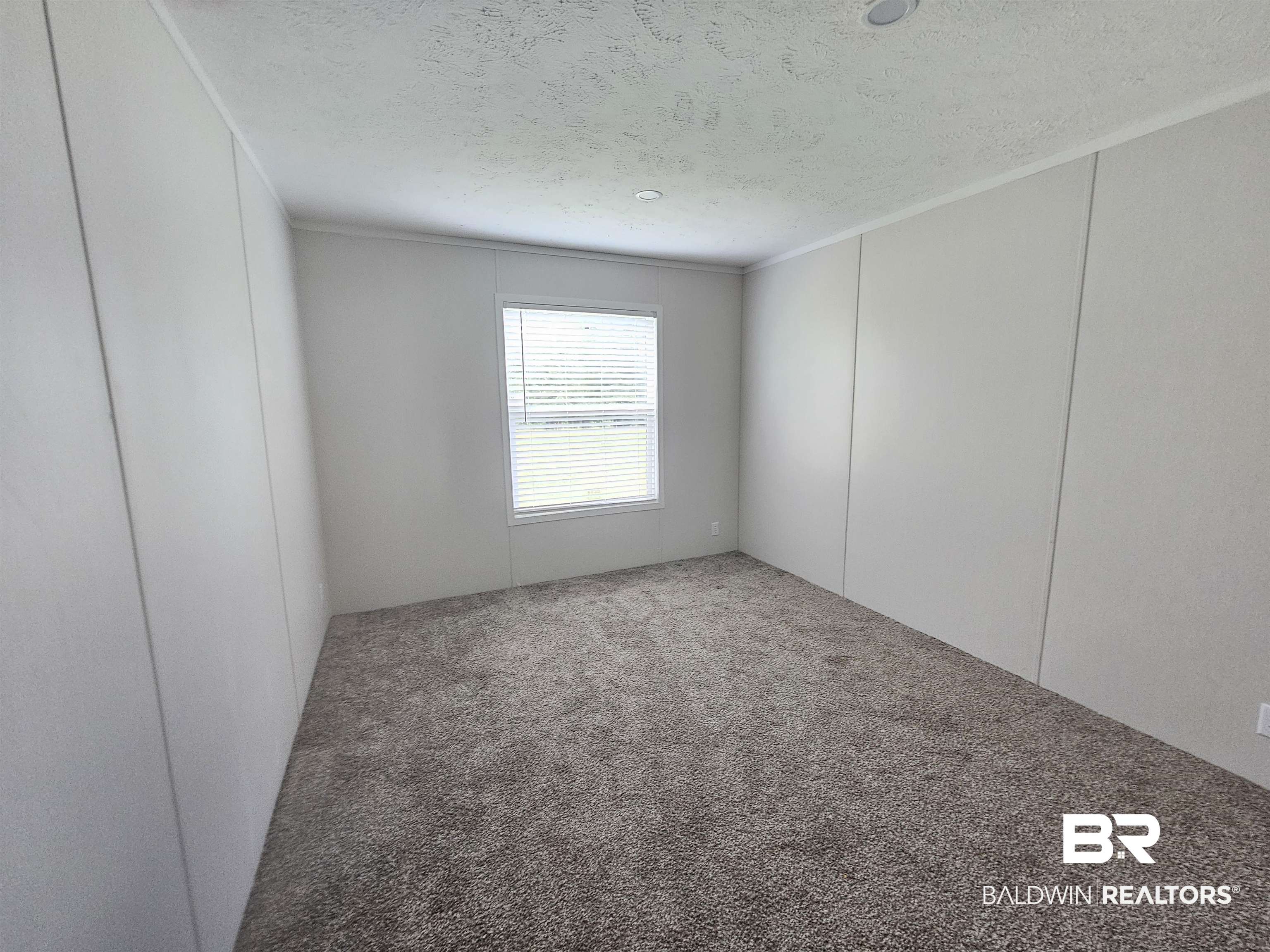 1863 Wait Road Monroeville, AL 36460 - Photo 15 of 38 Carpeted spare room with a textured ceiling