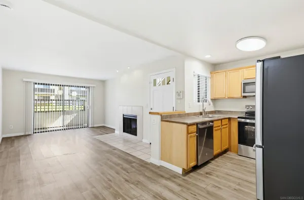 a kitchen with stainless steel appliances granite countertop a stove and a sink
