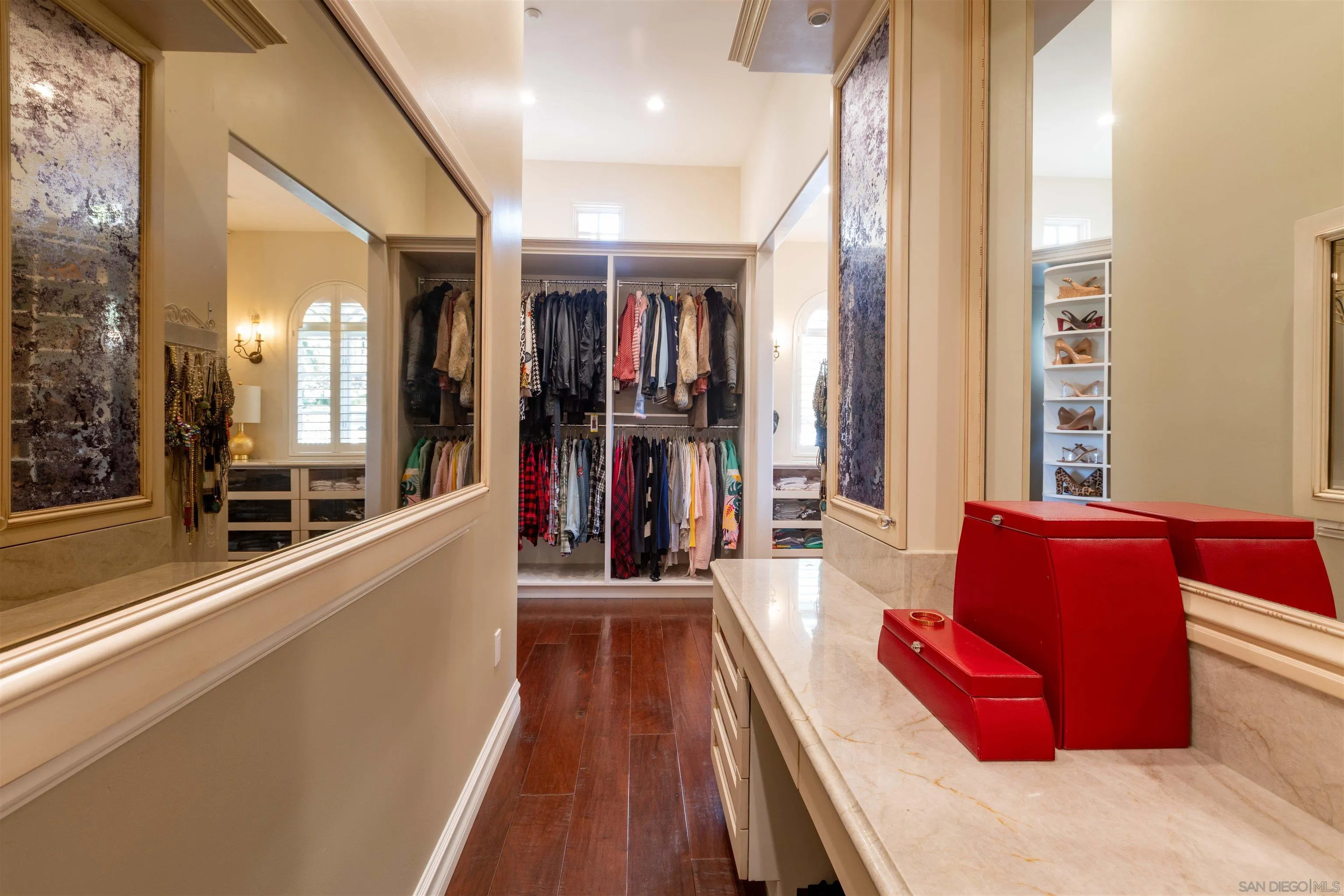 17676 Vista Rancho Court Rancho Santa Fe, CA 92091 - Photo 29 of 71 a hallway with a couch and a large window with the outer view