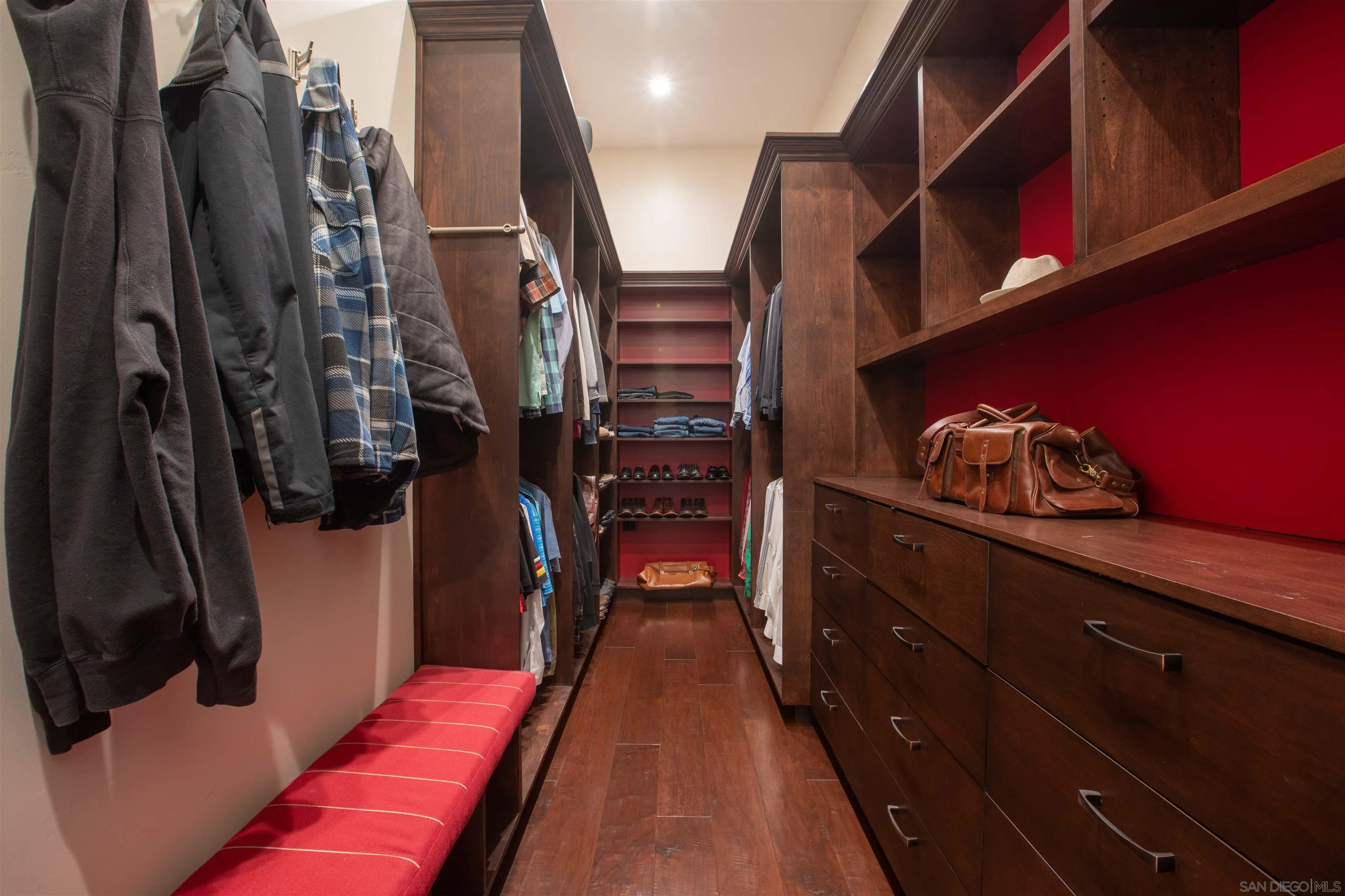 17676 Vista Rancho Court Rancho Santa Fe, CA 92091 - Photo 30 of 71 a view of walk in closet with clothes and shoes