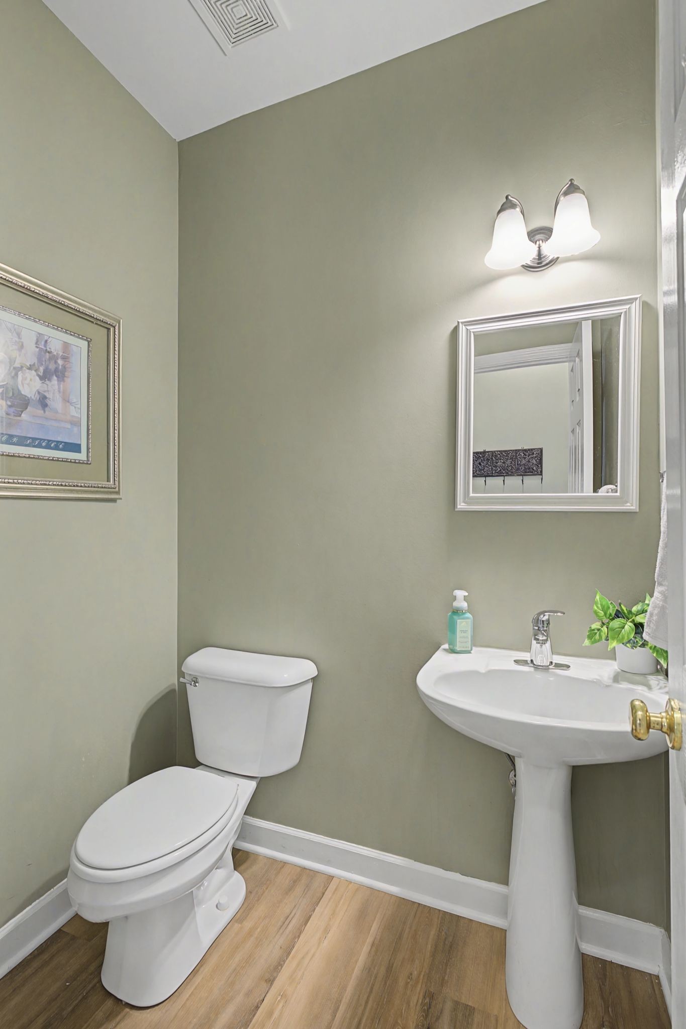 4012 Farmville Court Spring Hill, TN 37174 - Photo 11 of 29 a bathroom with a sink mirror and toilet