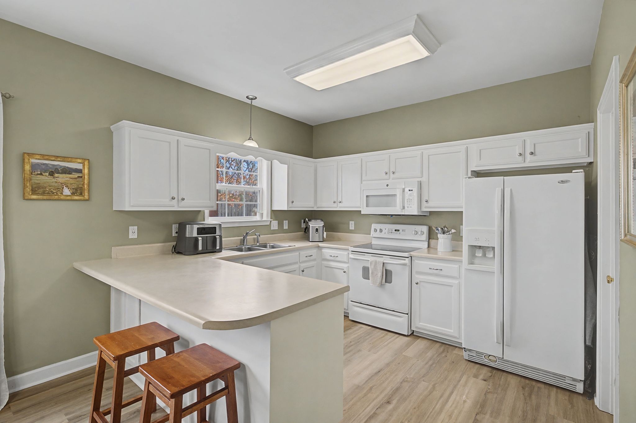 4012 Farmville Court Spring Hill, TN 37174 - Photo 13 of 29 a kitchen with cabinets appliances and wooden floor