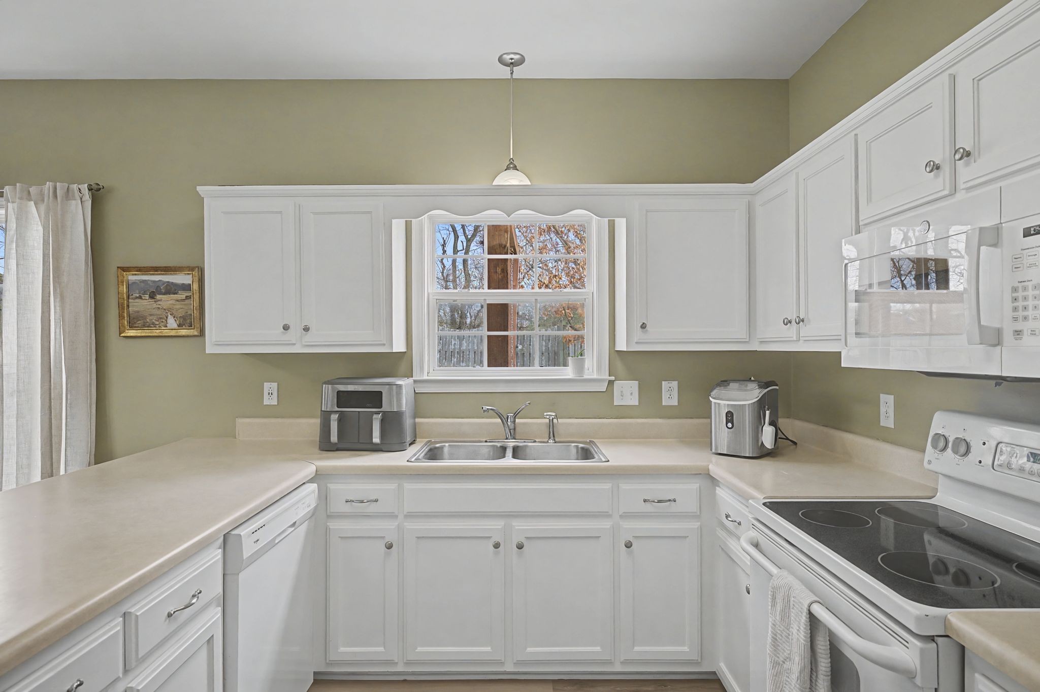 4012 Farmville Court Spring Hill, TN 37174 - Photo 14 of 29 a kitchen with granite countertop white cabinets and a sink
