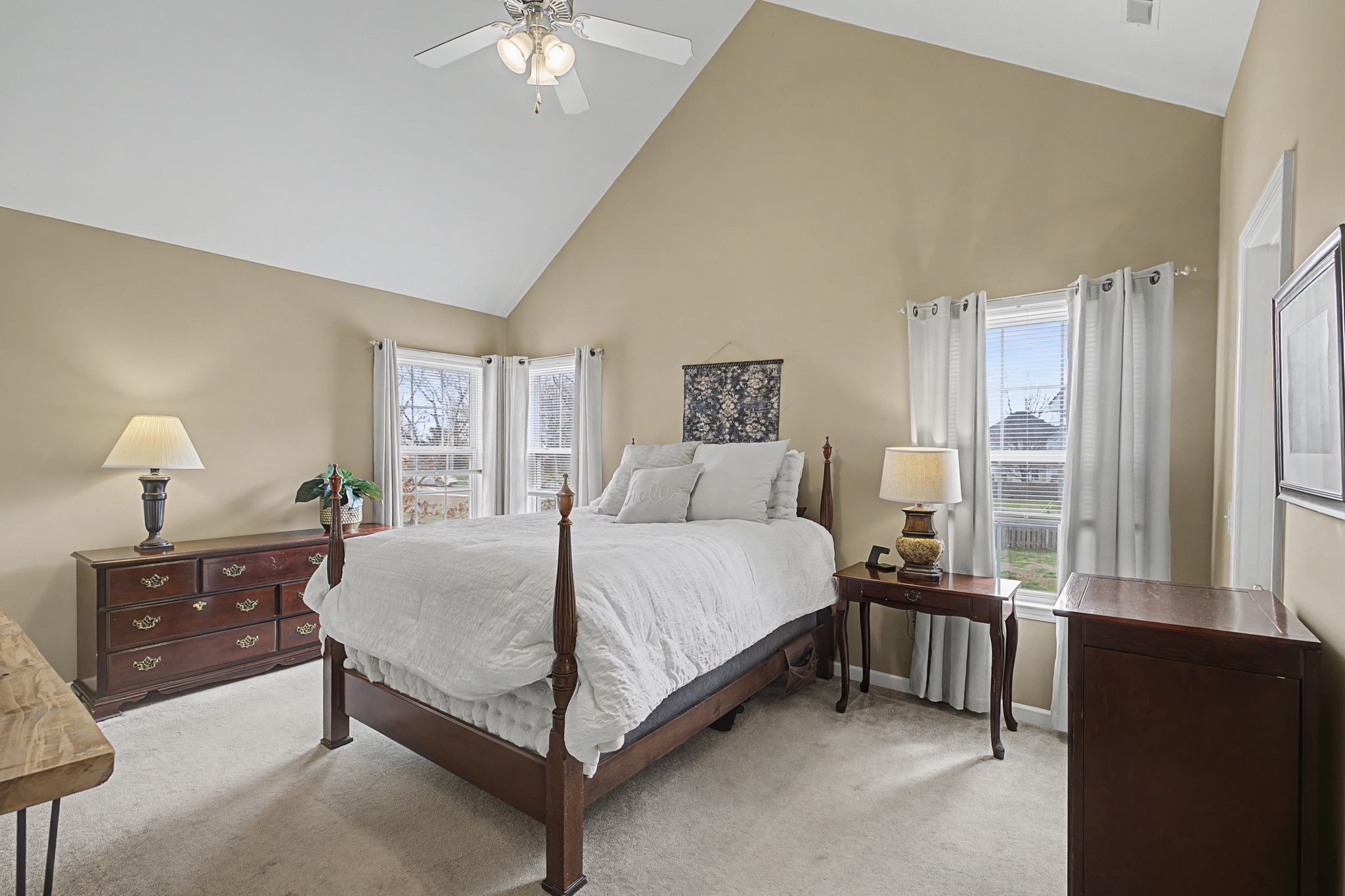 4012 Farmville Court Spring Hill, TN 37174 - Photo 18 of 29 a bedroom with a bed and a lamp on dresser