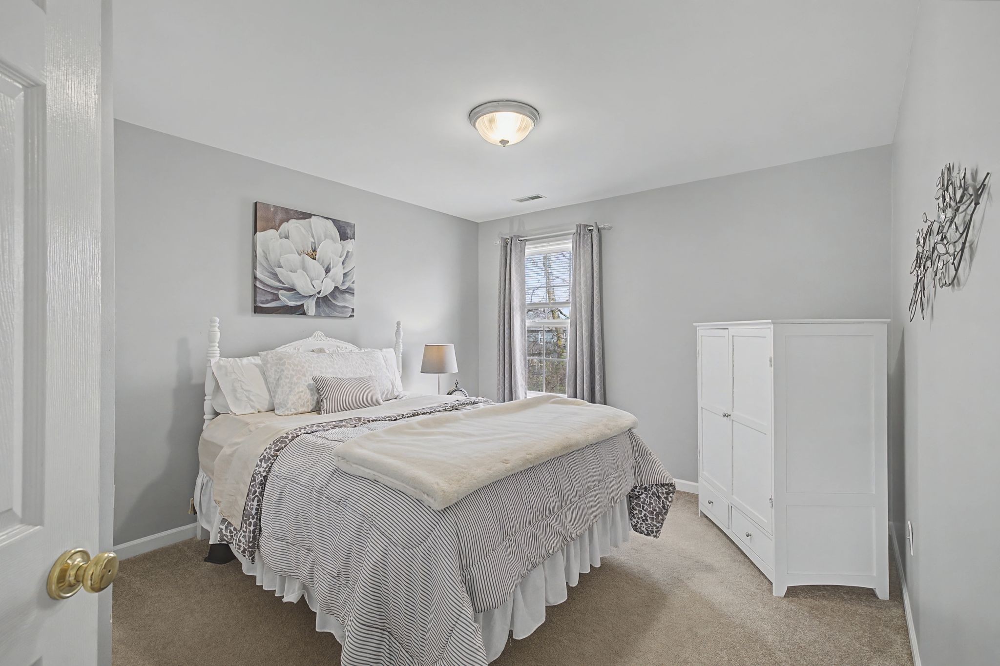 4012 Farmville Court Spring Hill, TN 37174 - Photo 23 of 29 a spacious bedroom with a bed and a window
