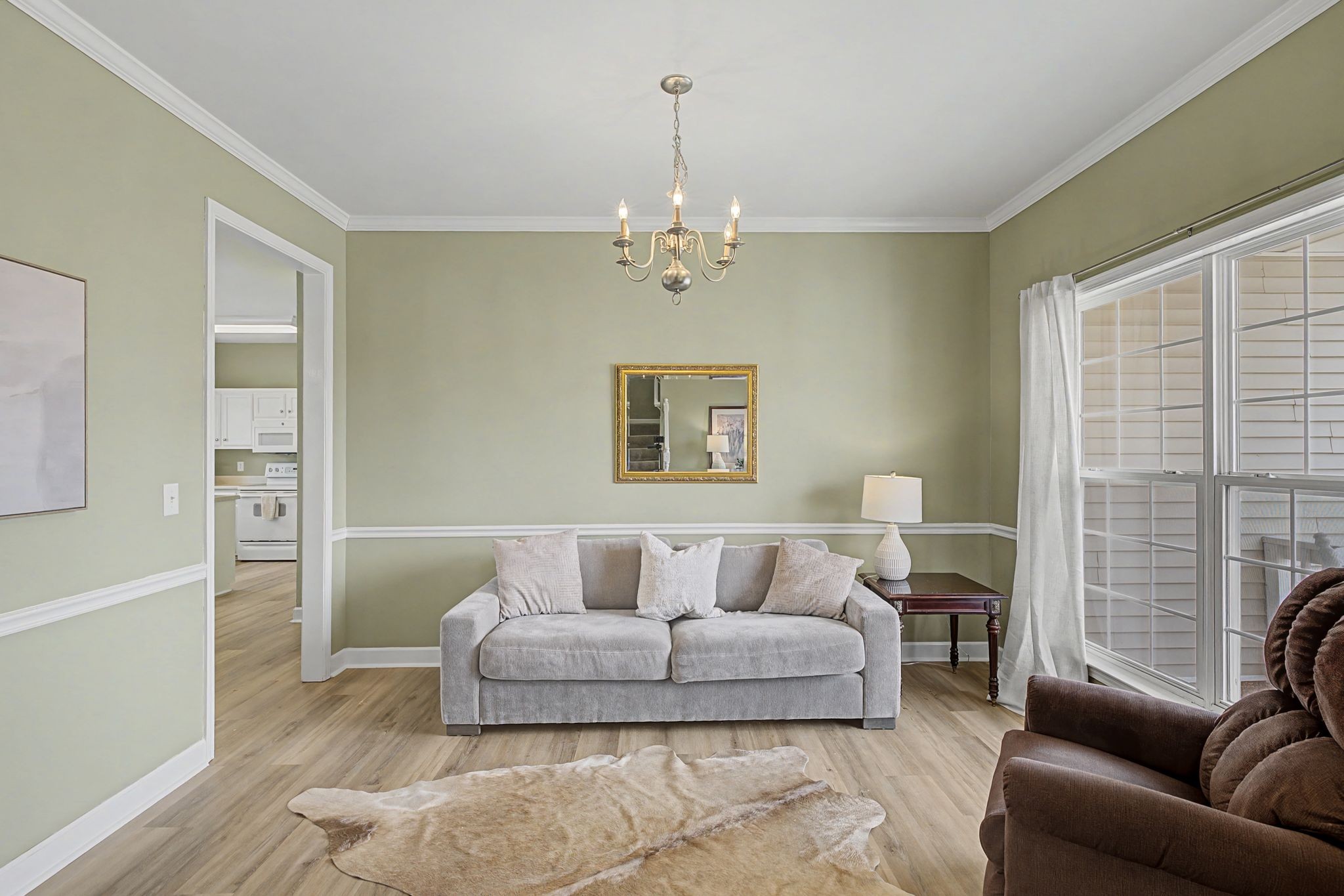 4012 Farmville Court Spring Hill, TN 37174 - Photo 6 of 29 a living room with furniture and a chandelier