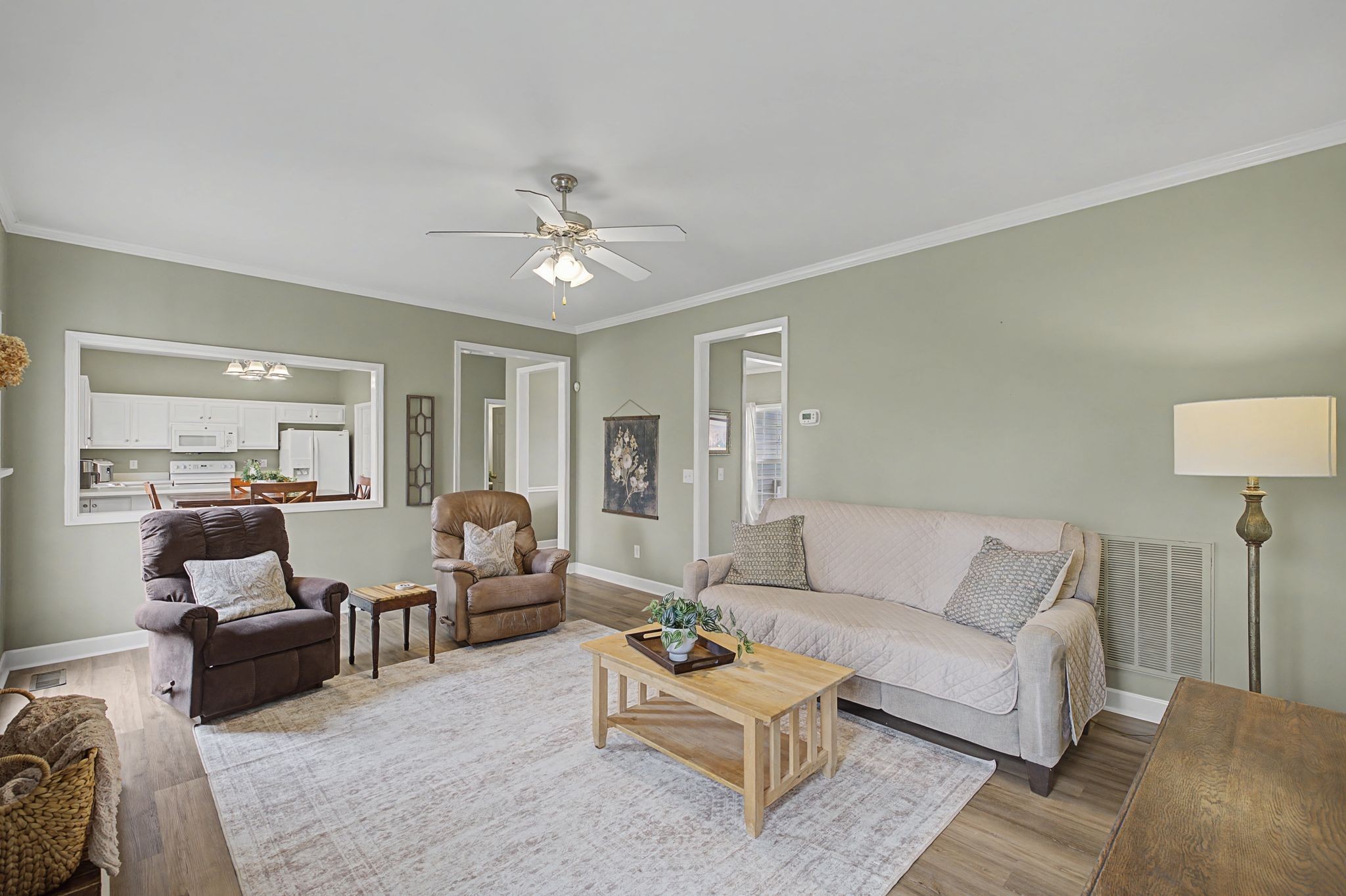 4012 Farmville Court Spring Hill, TN 37174 - Photo 8 of 29 a living room with furniture and a lamp