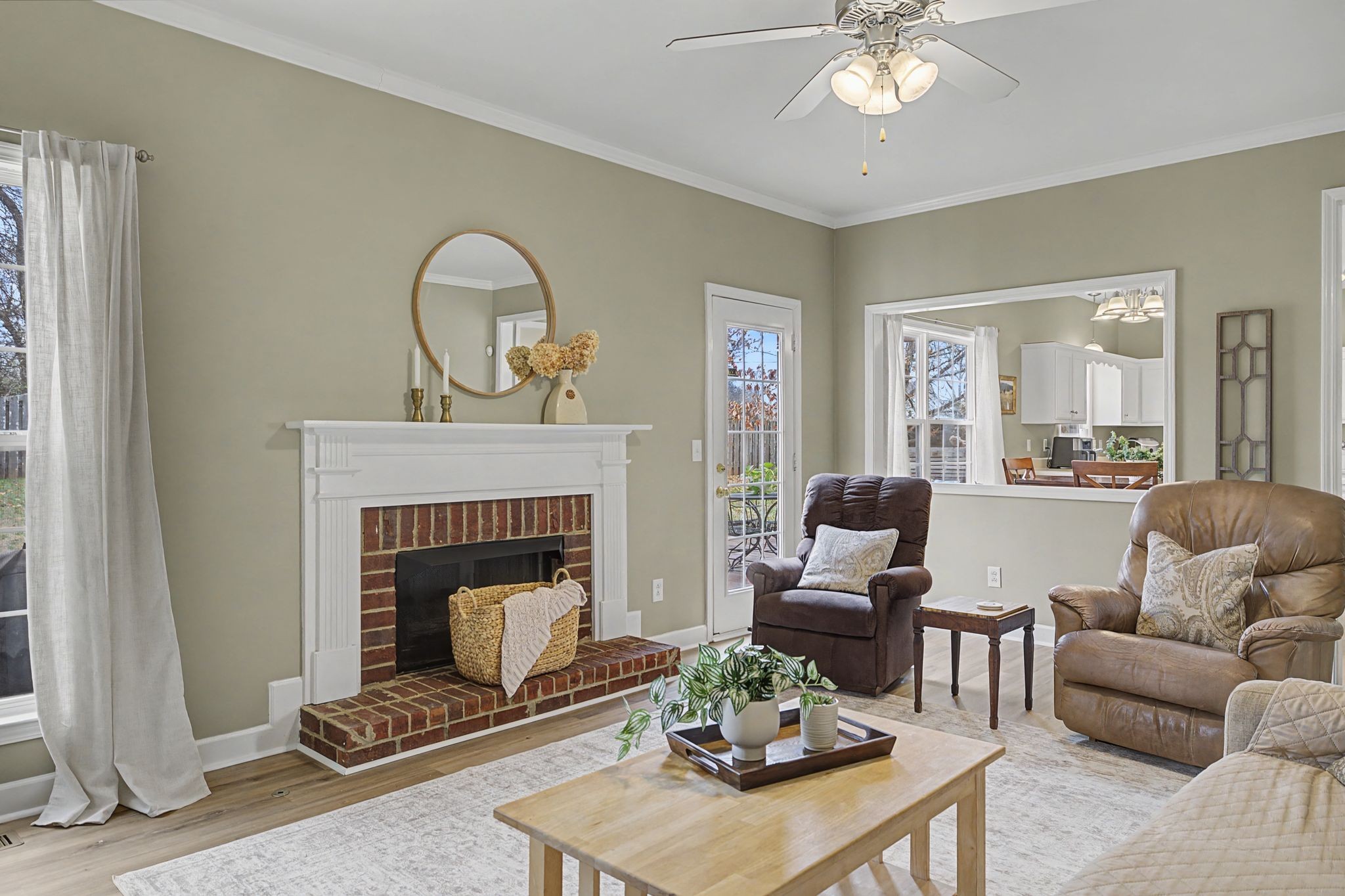 4012 Farmville Court Spring Hill, TN 37174 - Photo 10 of 29 a living room with furniture a fireplace and a potted plant