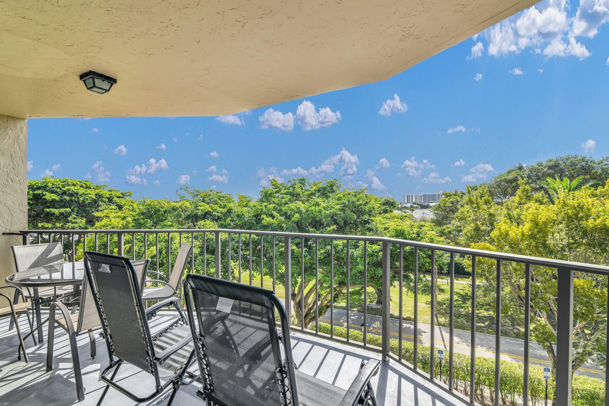 859 Jeffery Street, Unit 5090 Boca Raton, FL 33487 - Photo 27 of 55 a view of a balcony with chair and table