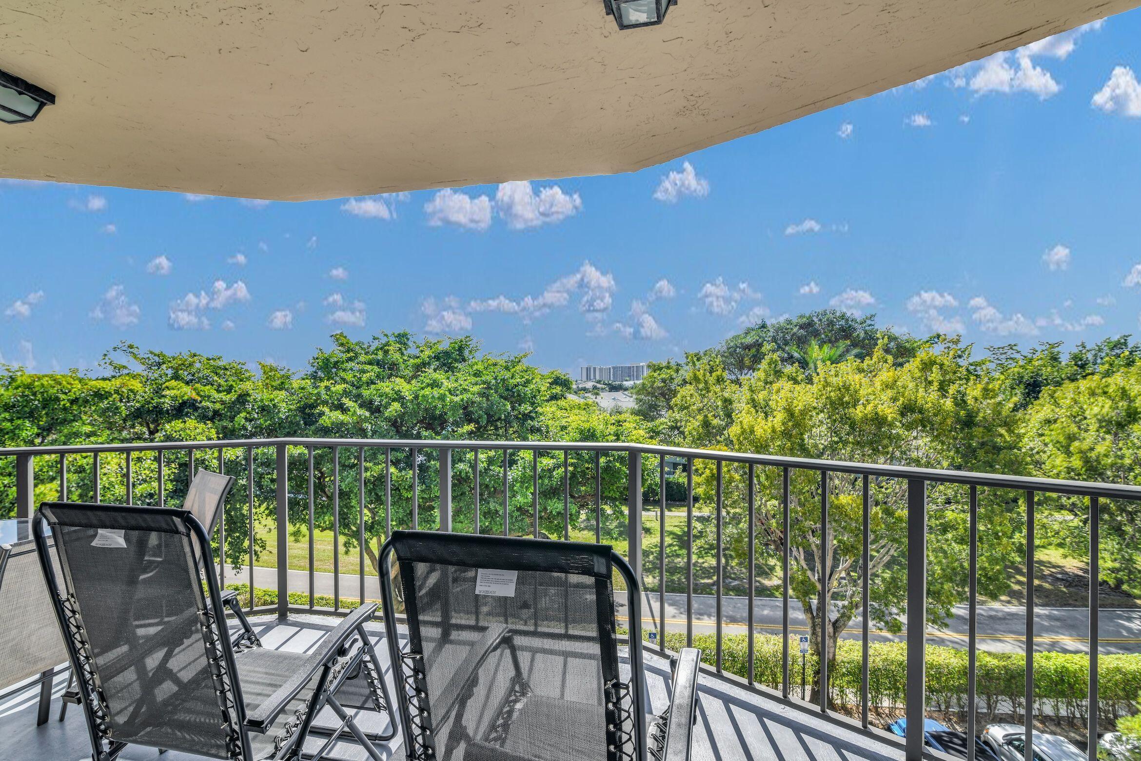 859 Jeffery Street, Unit 5090 Boca Raton, FL 33487 - Photo 28 of 55 a view of a balcony with lake view and sitting space