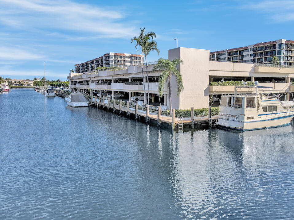 859 Jeffery Street, Unit 5090 Boca Raton, FL 33487 - Photo 49 of 55 a view of a lake with building in front of it