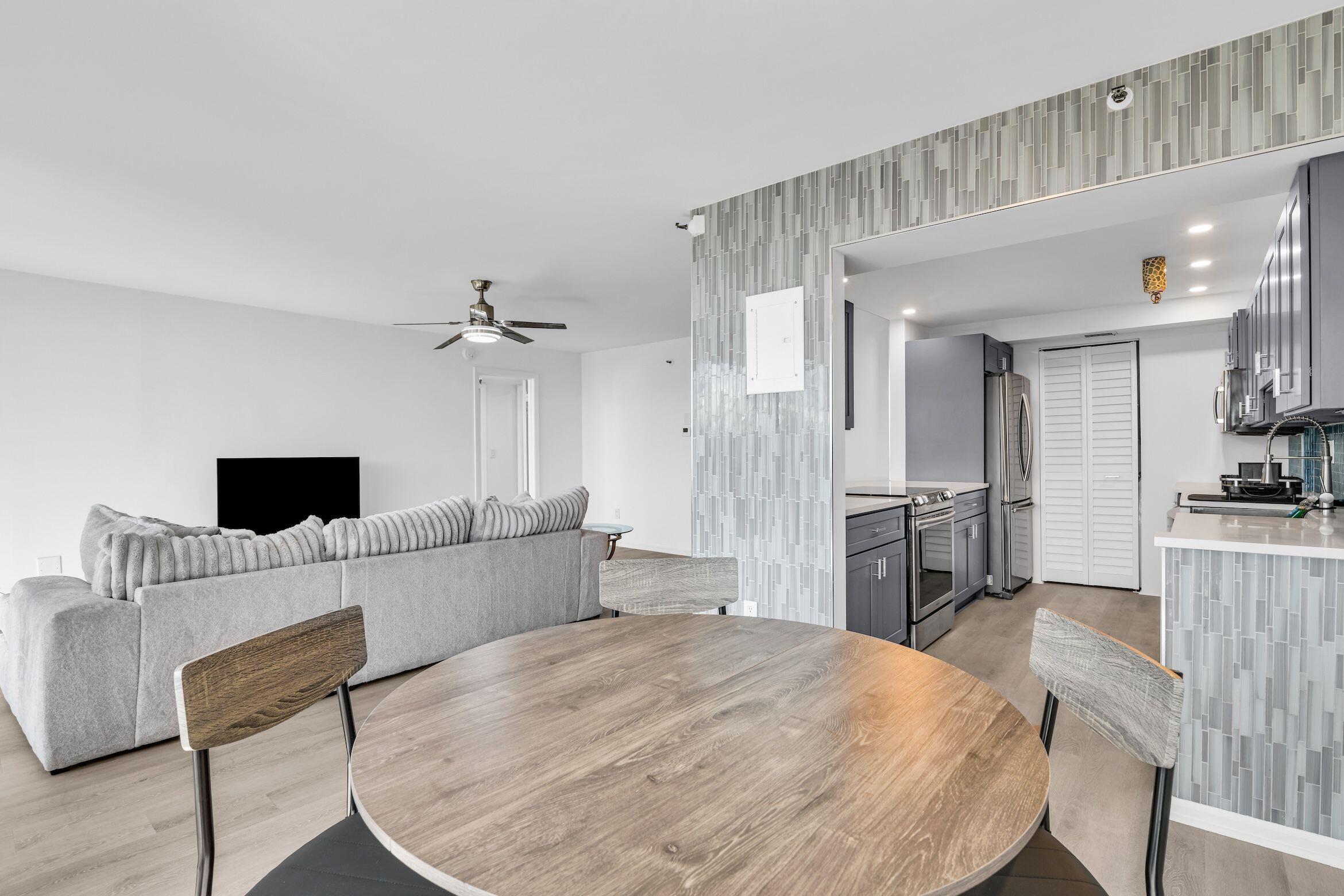 859 Jeffery Street, Unit 5090 Boca Raton, FL 33487 - Photo 9 of 55 a large bedroom with a bed and a view of kitchen