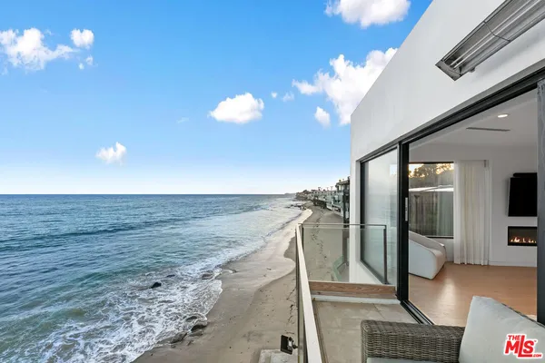 a view of a living room with a flat screen tv