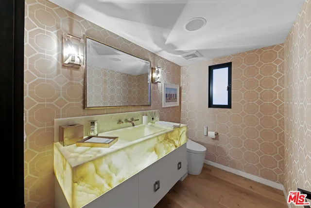 a bathroom with a double vanity sink mirror and double