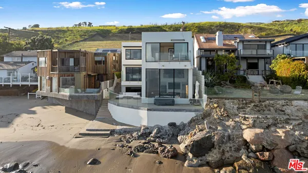 a view of a house with a yard balcony