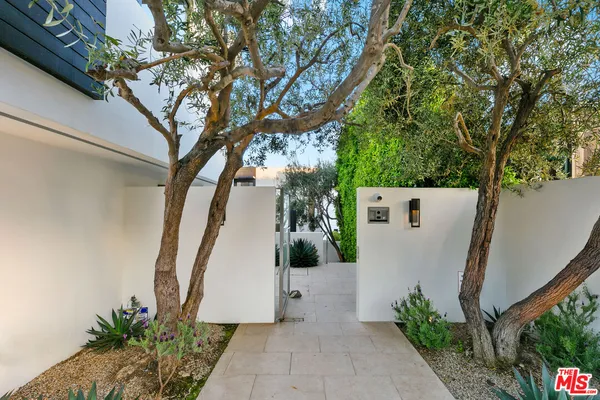 a view of a house with a tree