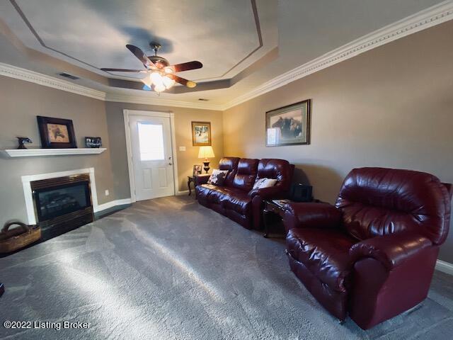 Carpeted Living Room with crown molding