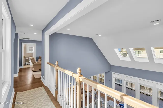 a view of a hallway with windows