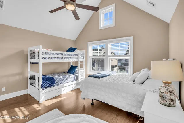 a bedroom with a bed and a table