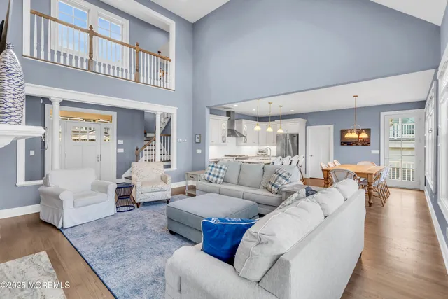 a living room with furniture or couch and a wooden floor