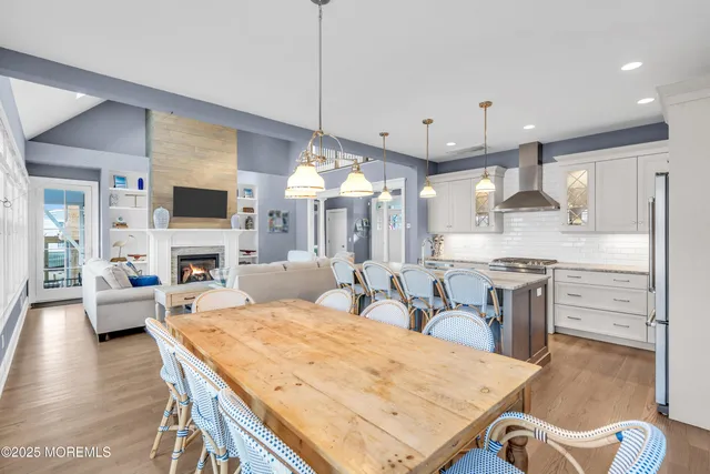 a large kitchen with kitchen island a large island in the center