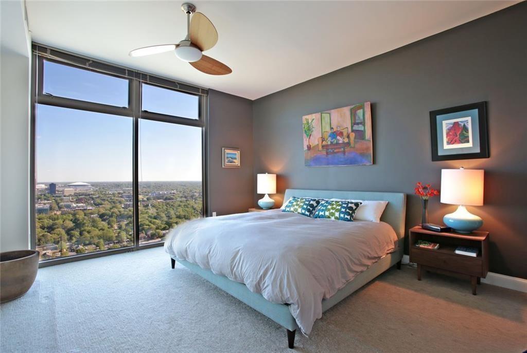 270 17th Street Northwest, Unit 4201 Atlanta, GA 30363 - Photo 12 of 23 a bedroom with a bed and a window