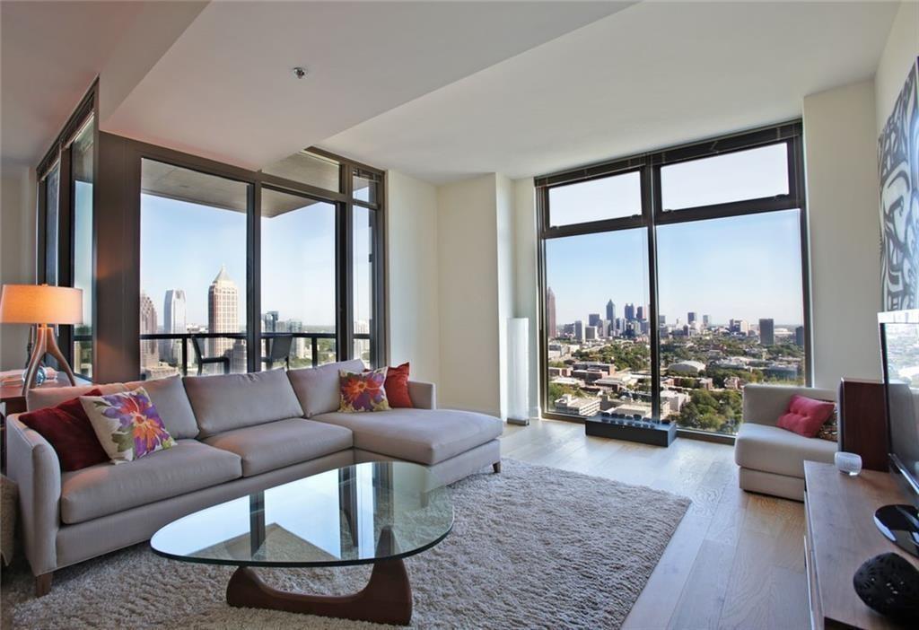 270 17th Street Northwest, Unit 4201 Atlanta, GA 30363 - Photo 3 of 23 a living room with furniture and a large window with outer view