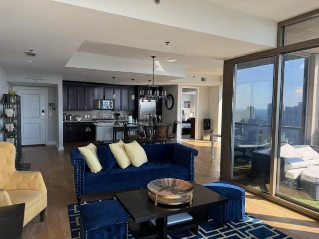 270 17th Street Northwest, Unit 4201 Atlanta, GA 30363 - Photo 4 of 23 a living room with stainless steel appliances kitchen island granite countertop furniture and a view of kitchen
