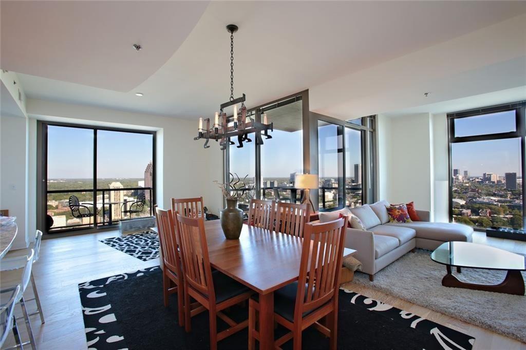 270 17th Street Northwest, Unit 4201 Atlanta, GA 30363 - Photo 5 of 23 a view of a dining room with furniture window and wooden floor