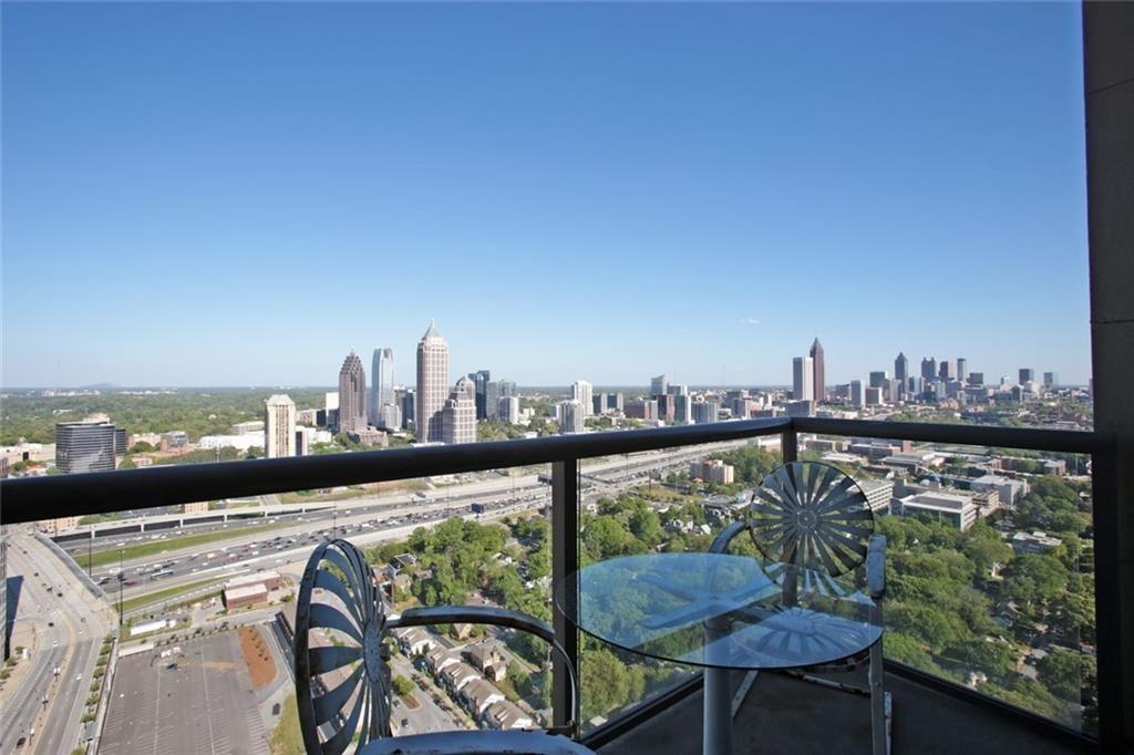 270 17th Street Northwest, Unit 4201 Atlanta, GA 30363 - Photo 8 of 23 a view of a balcony and an outdoor seating