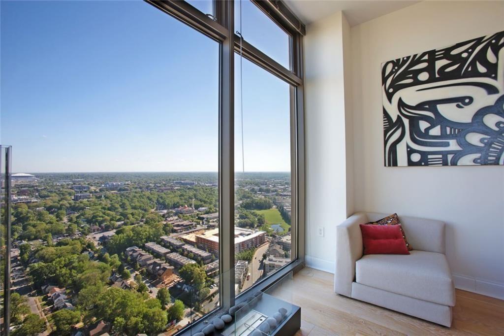 270 17th Street Northwest, Unit 4201 Atlanta, GA 30363 - Photo 10 of 23 a view of a living room and a floor to ceiling window