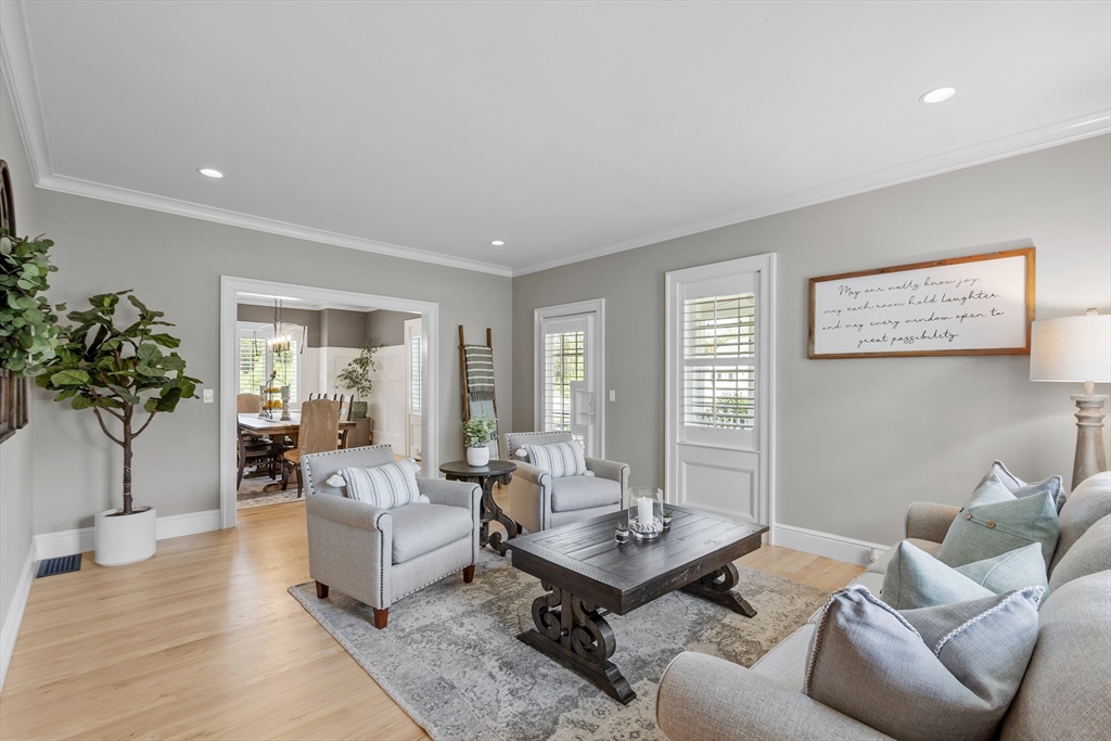 26 Mill Pond Road Bolton, MA 01740 - Photo 12 of 42 a living room with furniture and a potted plant