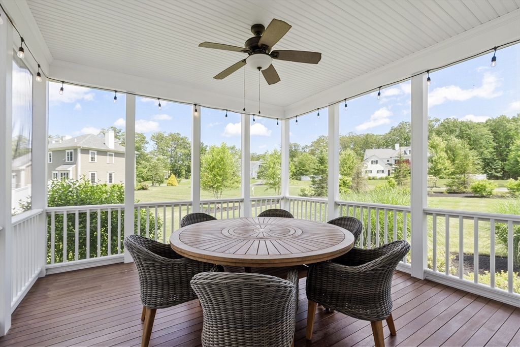 26 Mill Pond Road Bolton, MA 01740 - Photo 15 of 42 a view of a dining room with furniture window and wooden floor