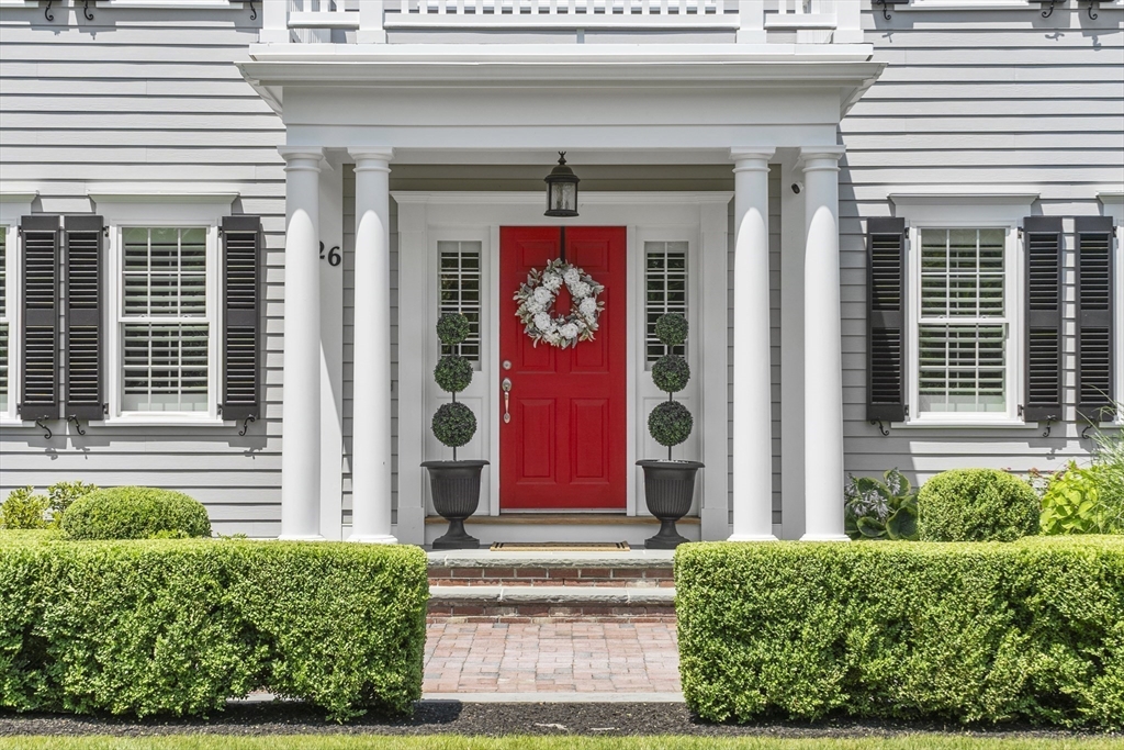 26 Mill Pond Road Bolton, MA 01740 - Photo 2 of 42 a front view of a house with a yard