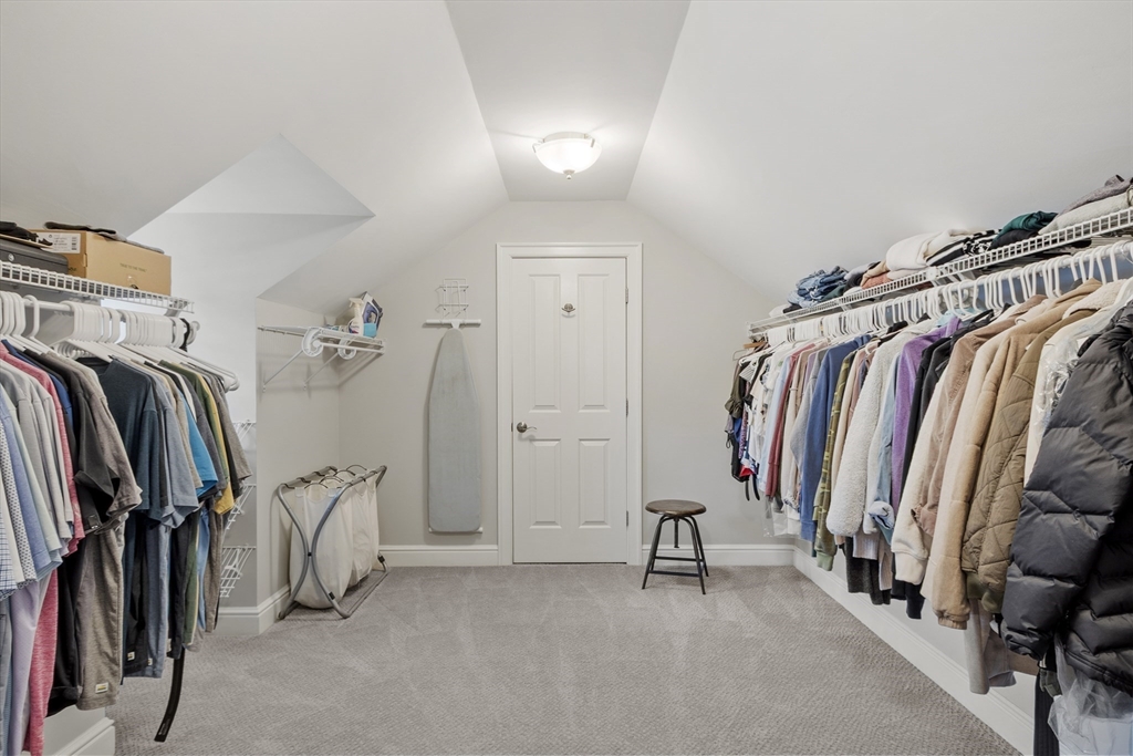26 Mill Pond Road Bolton, MA 01740 - Photo 22 of 42 a view of walk in closet with clothes and shoes