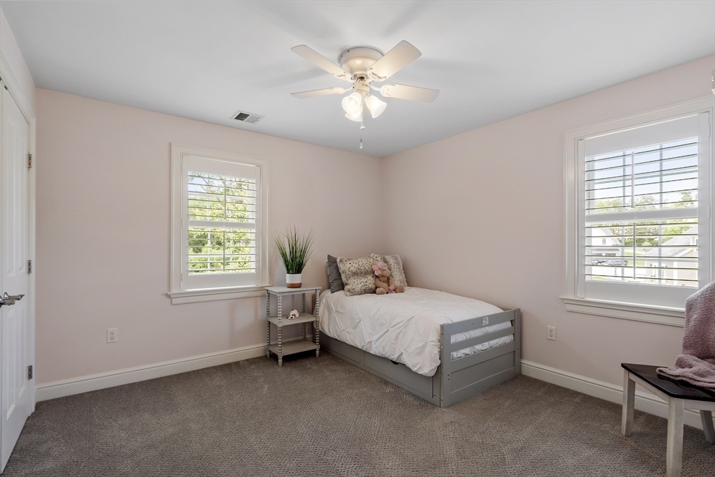 26 Mill Pond Road Bolton, MA 01740 - Photo 23 of 42 a bedroom with a bed and a window