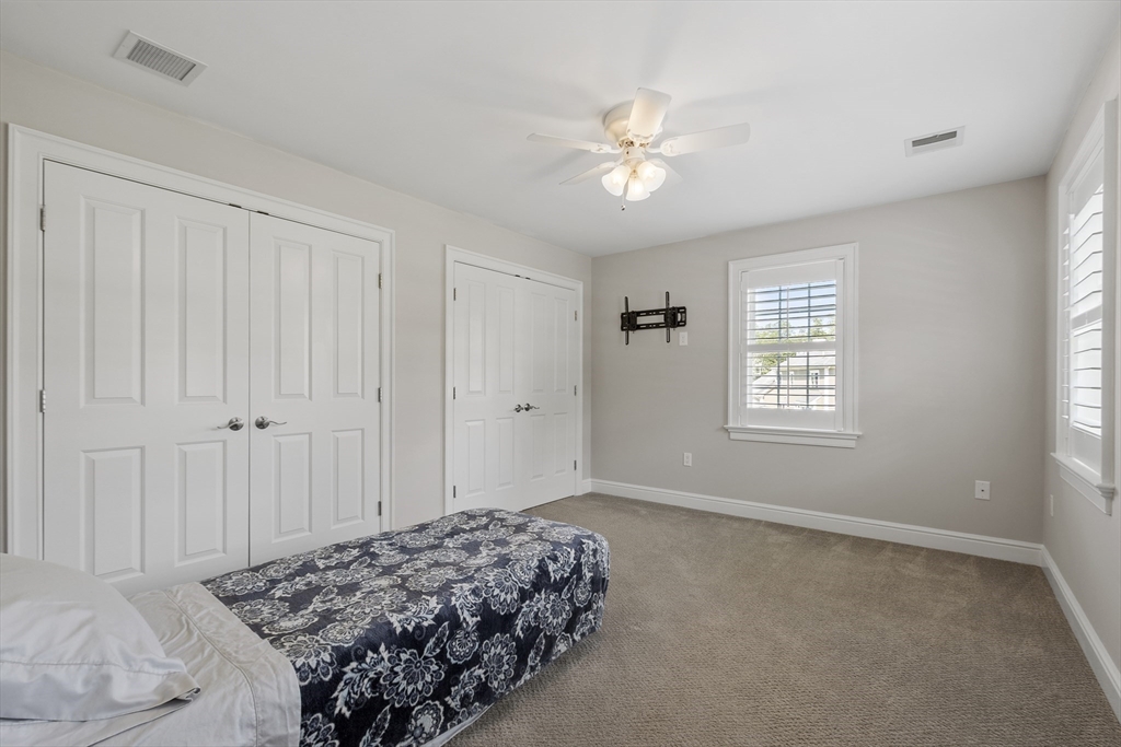 26 Mill Pond Road Bolton, MA 01740 - Photo 24 of 42 a bedroom with a bed and a window