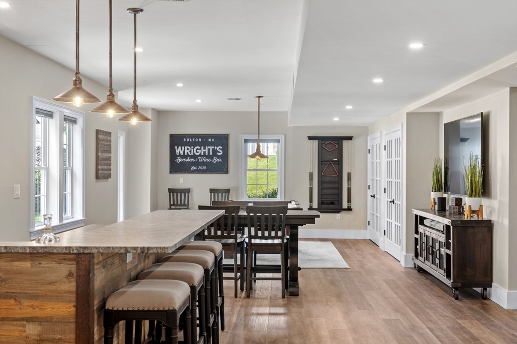 26 Mill Pond Road Bolton, MA 01740 - Photo 28 of 42 a view of a a dining room with furniture window and wooden floor