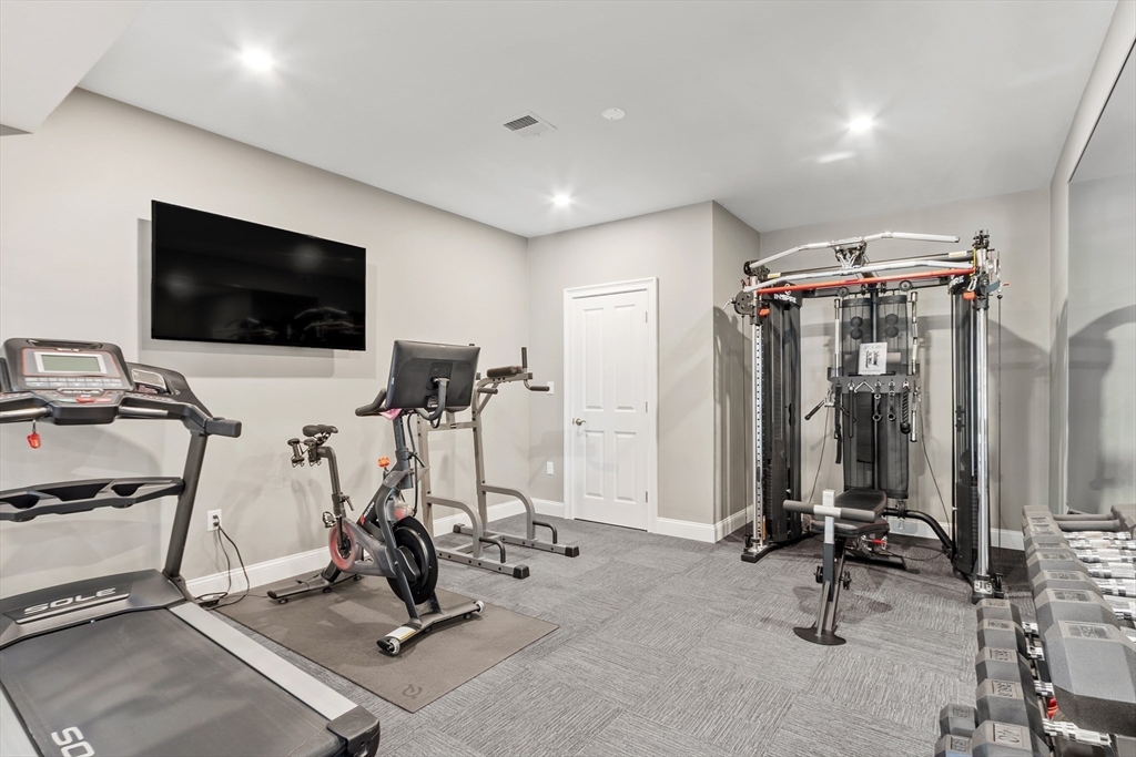 26 Mill Pond Road Bolton, MA 01740 - Photo 32 of 42 a view of a room with gym equipment