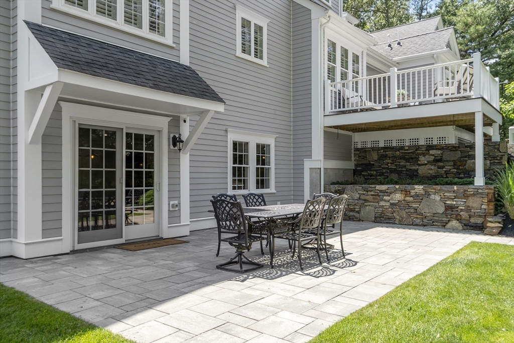26 Mill Pond Road Bolton, MA 01740 - Photo 34 of 42 a view of a house with backyard and sitting area