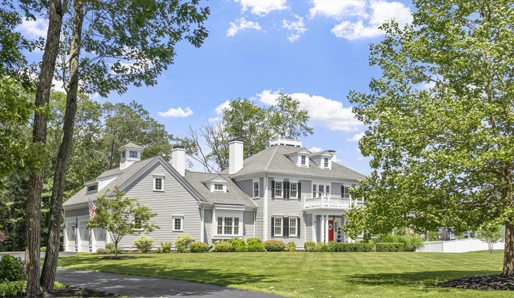 26 Mill Pond Road Bolton, MA 01740 - Photo 42 of 42 a front view of a house with a garden