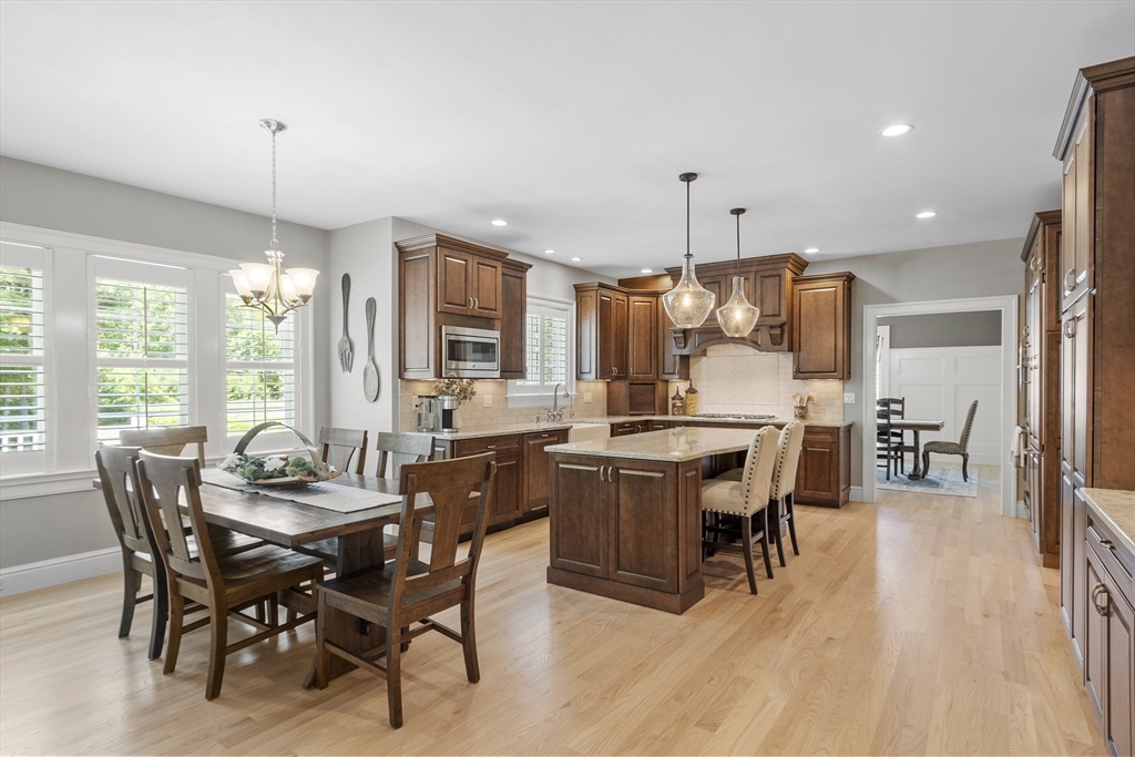 26 Mill Pond Road Bolton, MA 01740 - Photo 6 of 42 a view of a dining room with furniture window and wooden floor