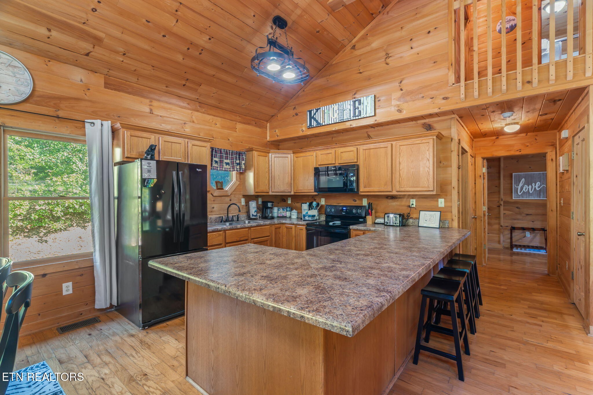 1723 Springer Road Sevierville, TN 37862 - Photo 20 of 43 a kitchen with stainless steel appliances granite countertop a kitchen island a refrigerator and a stove