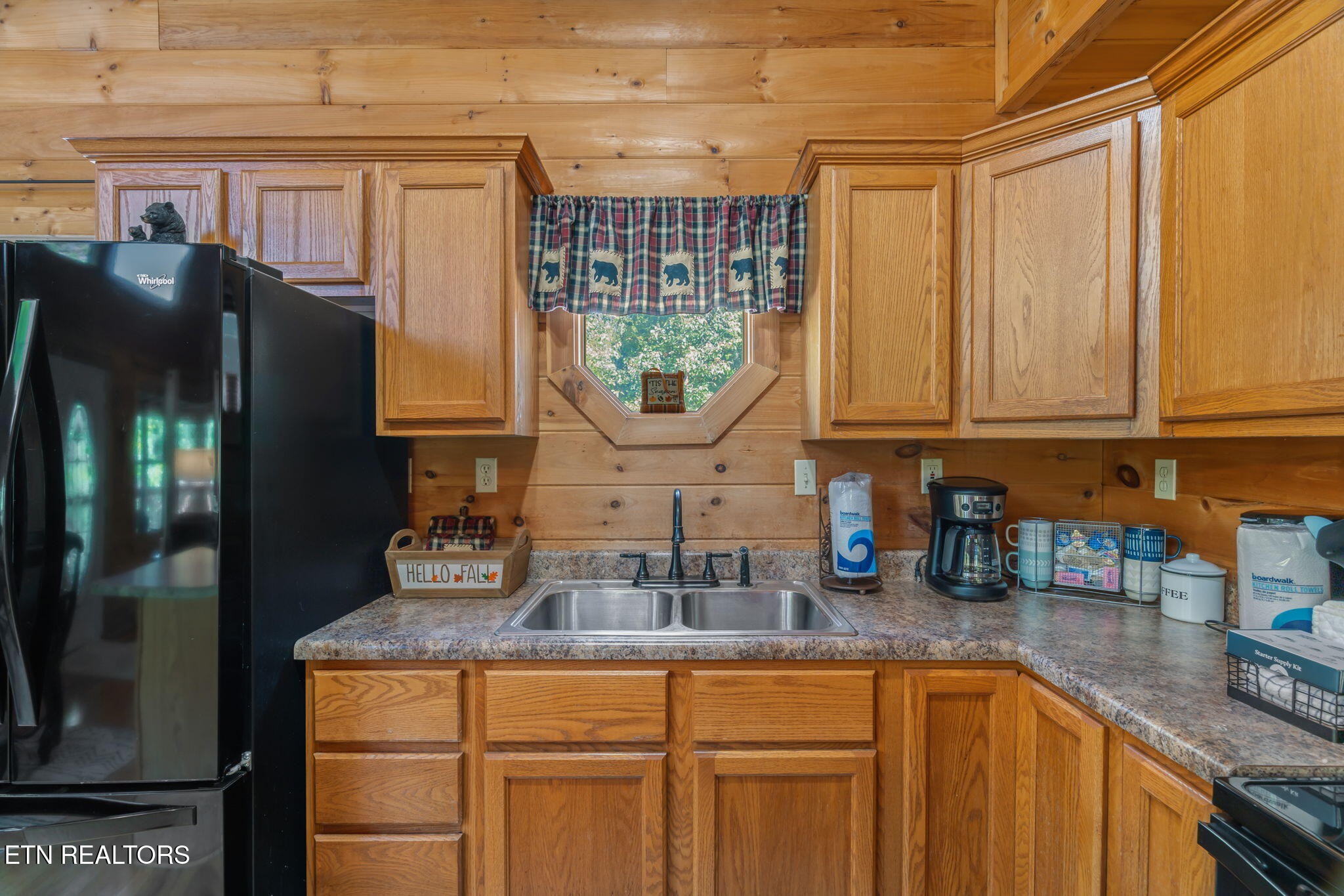 1723 Springer Road Sevierville, TN 37862 - Photo 22 of 43 a kitchen with stainless steel appliances granite countertop a sink and cabinets